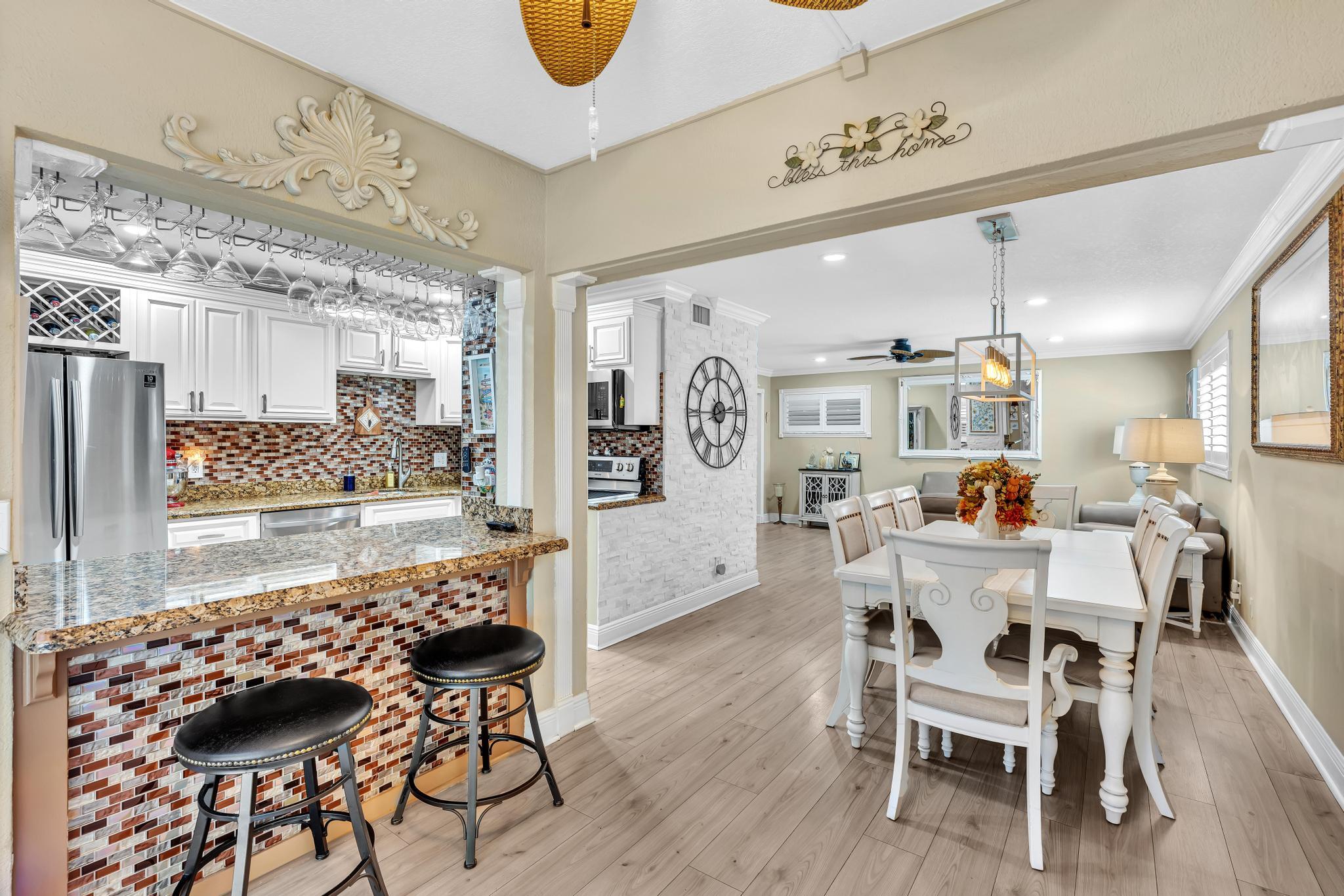 34 Colonial Club Drive, Unit 101 Boynton Beach, FL 33435 - Photo 7 of 58 a view of a dining room with furniture and wooden floor