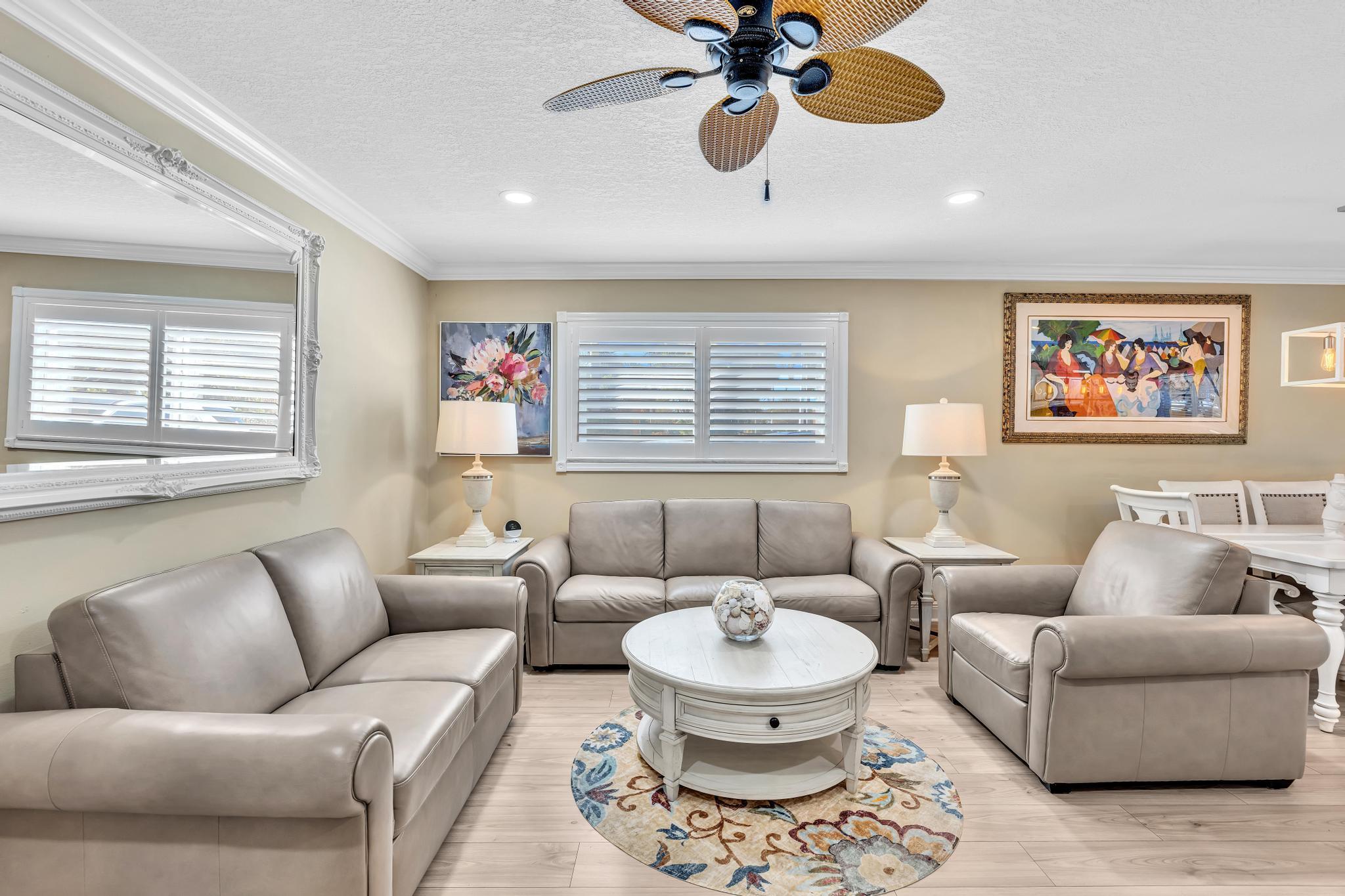 34 Colonial Club Drive, Unit 101 Boynton Beach, FL 33435 - Photo 10 of 58 a living room with furniture and a large window