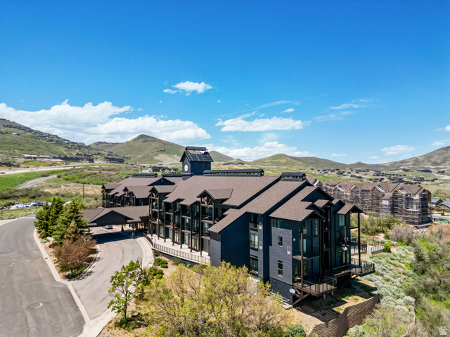 1364 Still Water Drive, Unit R2012 Heber City, UT 84032 - Photo 29 of 30 Multi-story structure featuring dark siding and a prominent clock tower with solar panels
