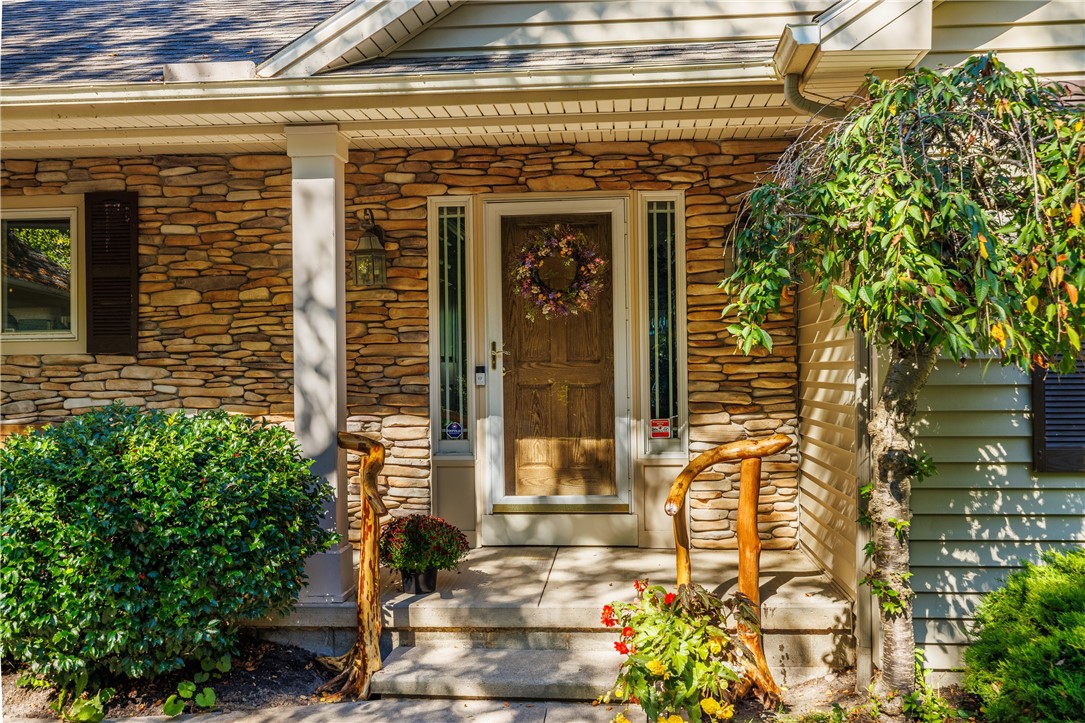 14789 Highview Road Carlton, NY 14477 - Photo 12 of 50 COVERED FRONT PORCH ENTRY WITH STONE ACCENT