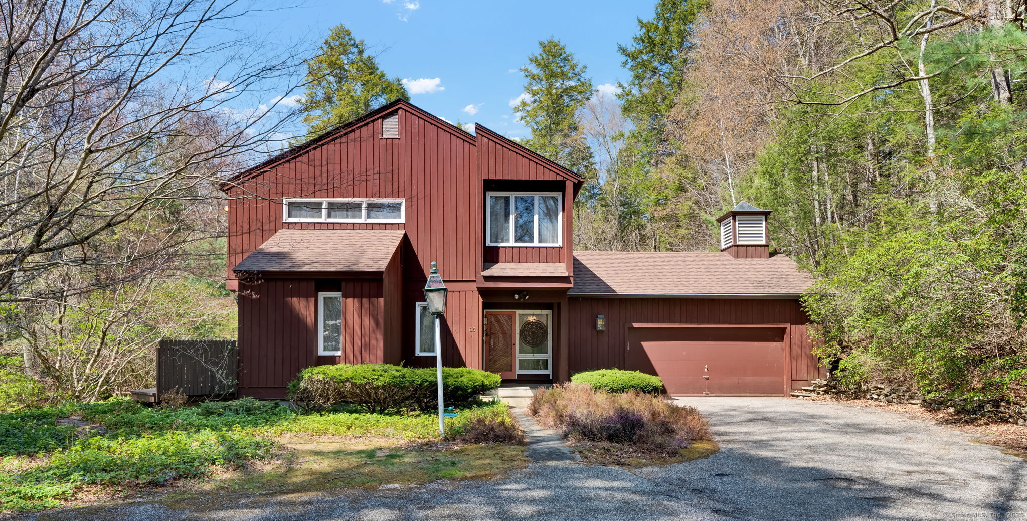 65 W Road Canton, CT 06019 - Photo 1 of 1 a front view of a house with garden
