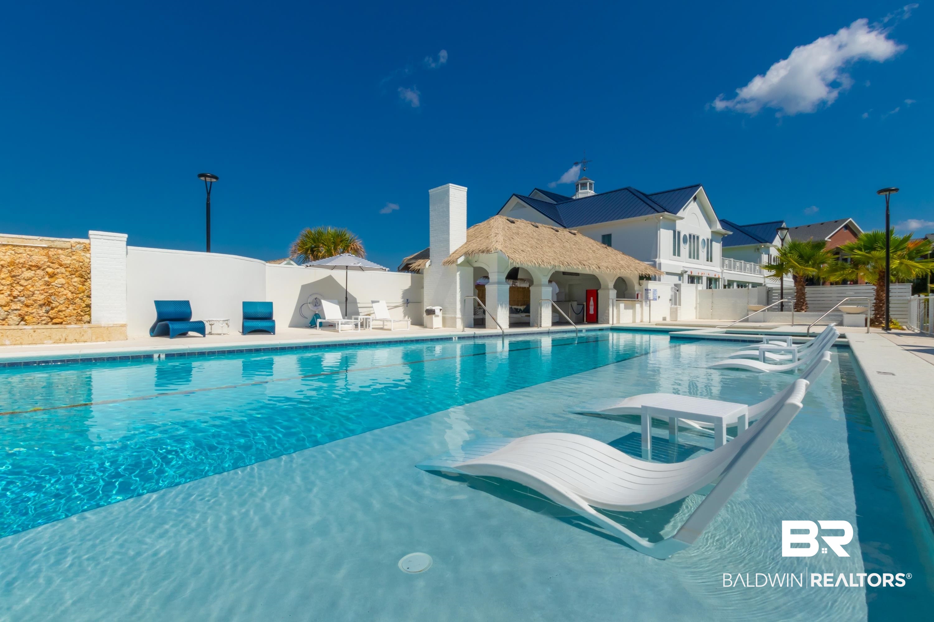 20050 Oak Road East Gulf Shores, AL 36542 - Photo 8 of 14 Community pool with a patio and a residential view