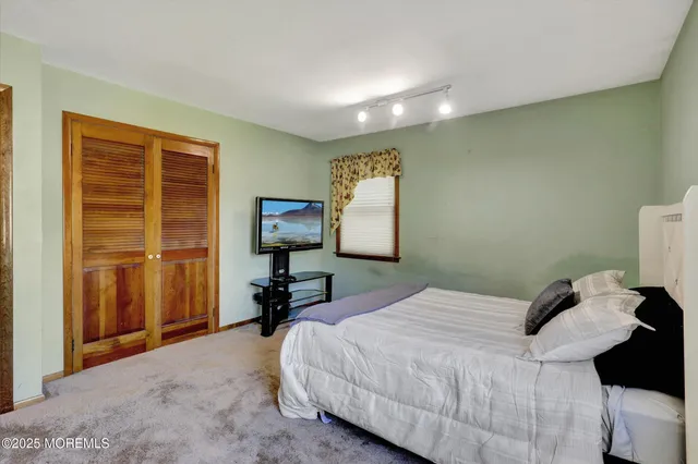 a bedroom with a bed and a table in it