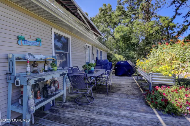 a view of backyard with seating and deck