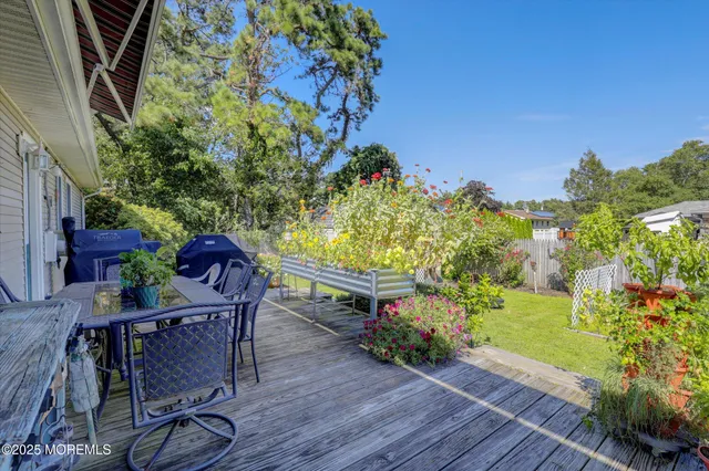 a view of a chairs and table in patio