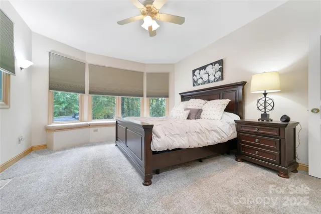 a bedroom with a bed dresser and a window