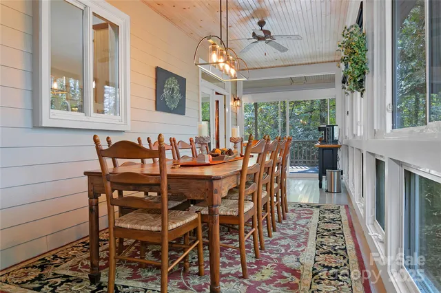 a view of a dining room with furniture window and outside view