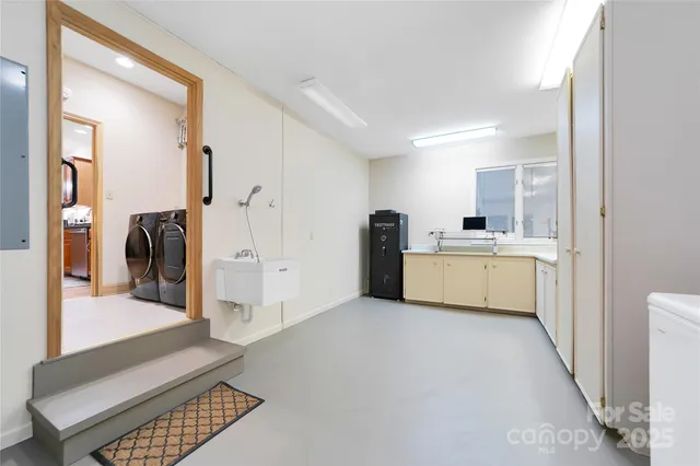 a view of a kitchen with a sink dishwasher and a refrigerator