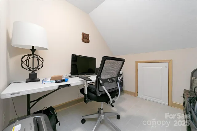 a view of a workspace with furniture