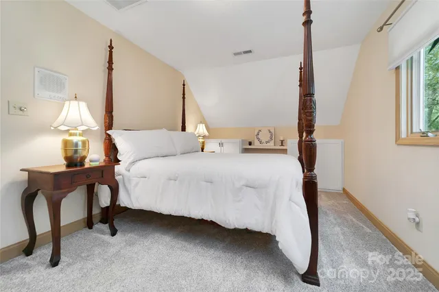 a bedroom with bed and window