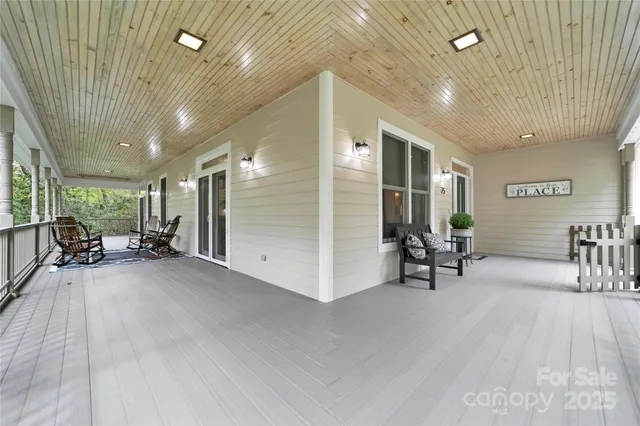 a view of a livingroom with furniture and a grill