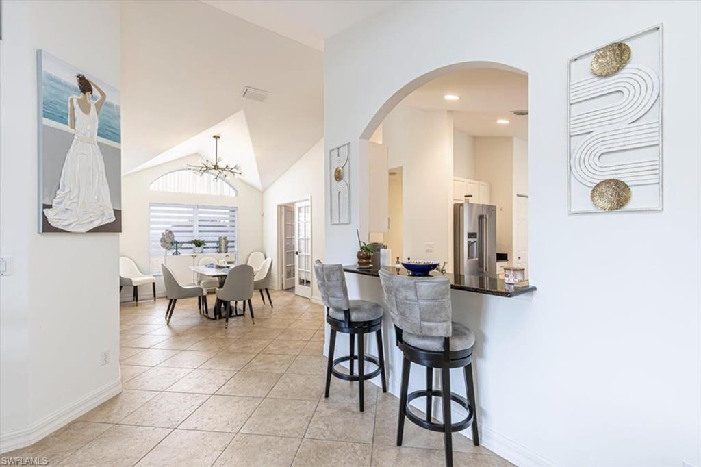 1630 Triangle Palm Terrace Naples, FL 34119 - Photo 10 of 24 a view of dining room and livingroom view
