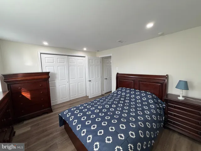 a bedroom with a bed and a fireplace