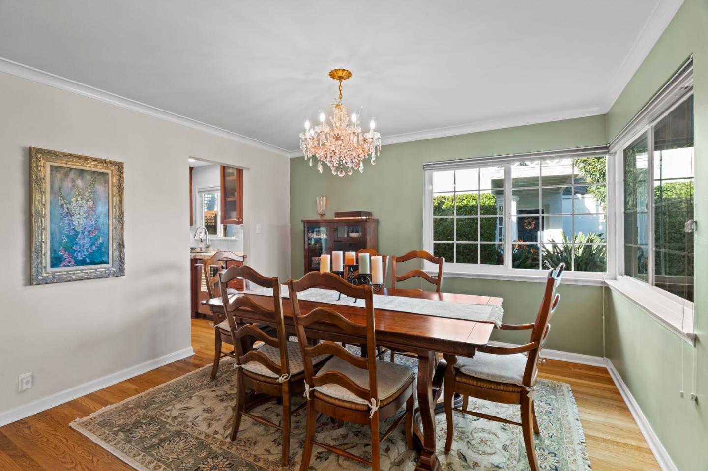 1765 Emory Street San Jose, CA 95126 - Photo 12 of 46 a view of a dining room with furniture wooden floor and a chandelier