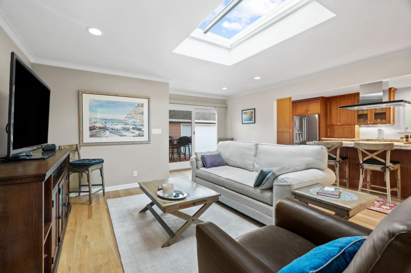 1765 Emory Street San Jose, CA 95126 - Photo 16 of 46 a living room with furniture a flat screen tv and kitchen view