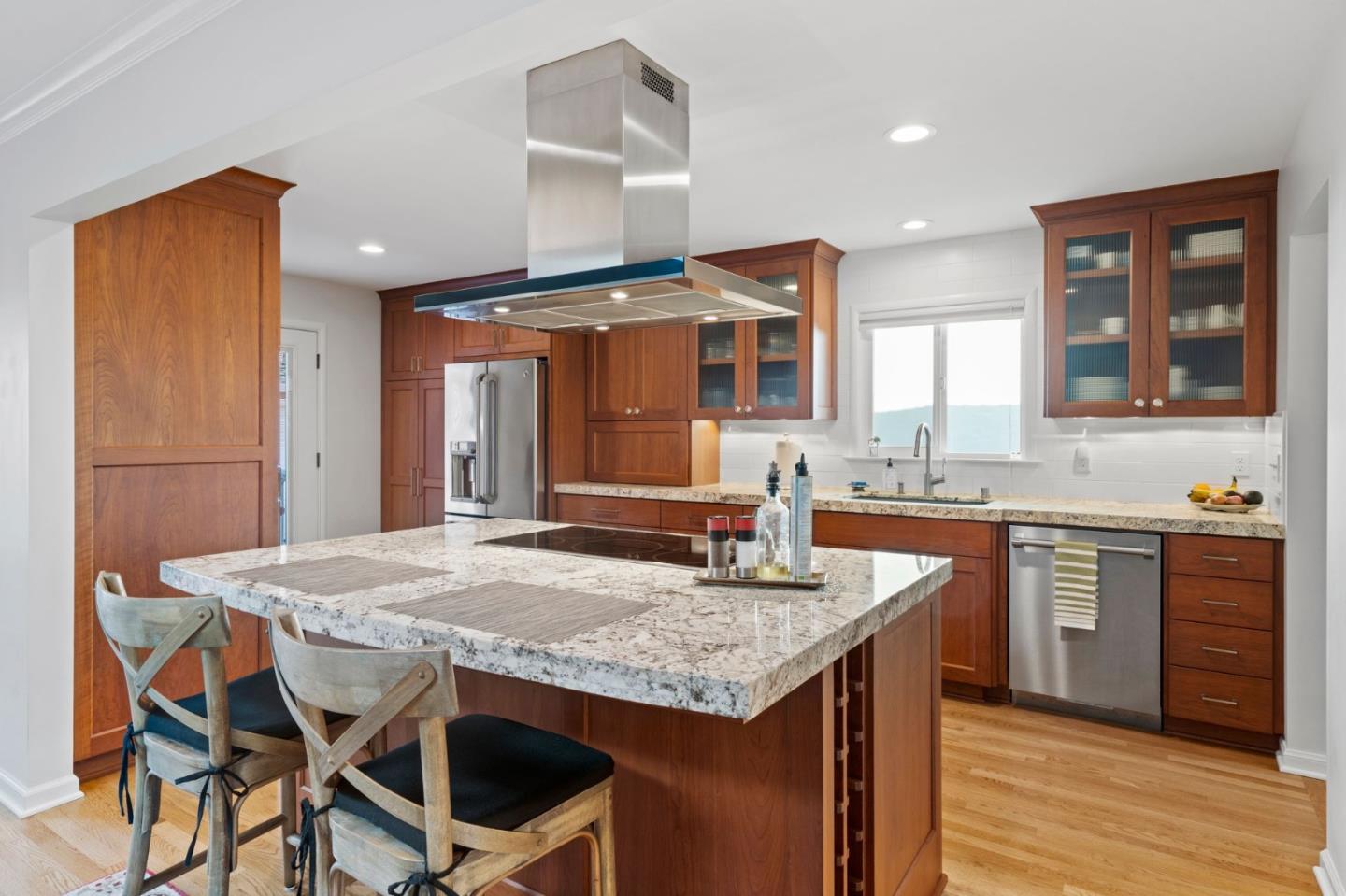 1765 Emory Street San Jose, CA 95126 - Photo 17 of 46 a kitchen with granite countertop kitchen island stainless steel appliances a sink stove and refrigerator