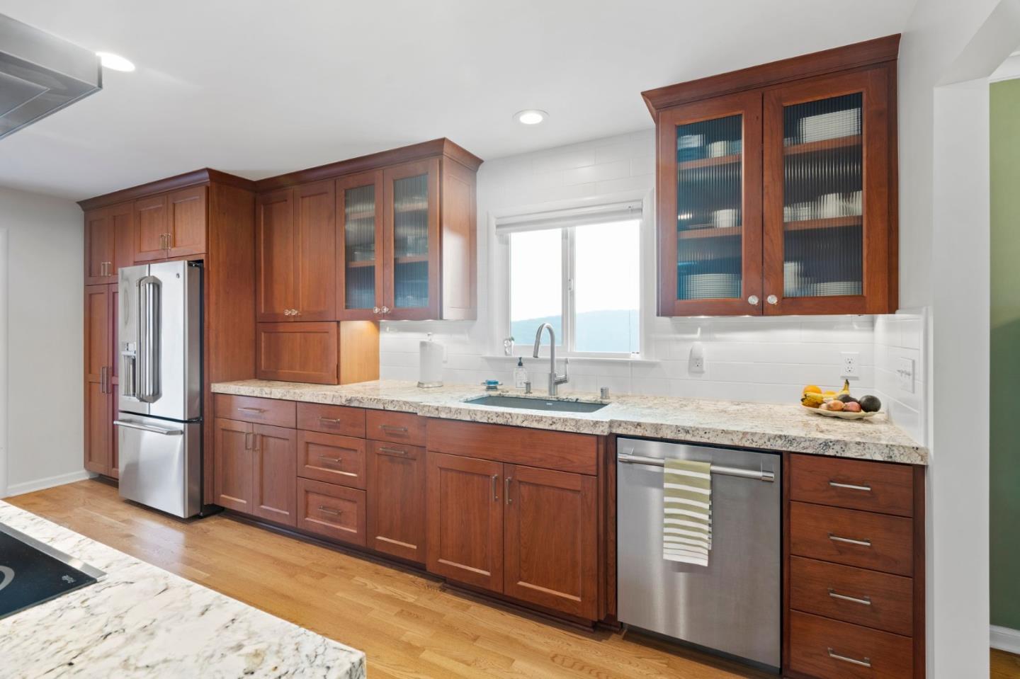 1765 Emory Street San Jose, CA 95126 - Photo 18 of 46 a kitchen with stainless steel appliances granite countertop a sink stove and refrigerator