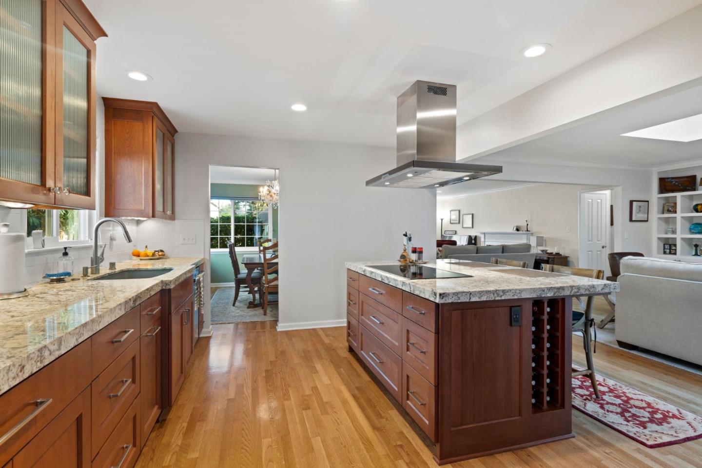 1765 Emory Street San Jose, CA 95126 - Photo 20 of 46 a kitchen with stainless steel appliances granite countertop a sink stove and wooden cabinets
