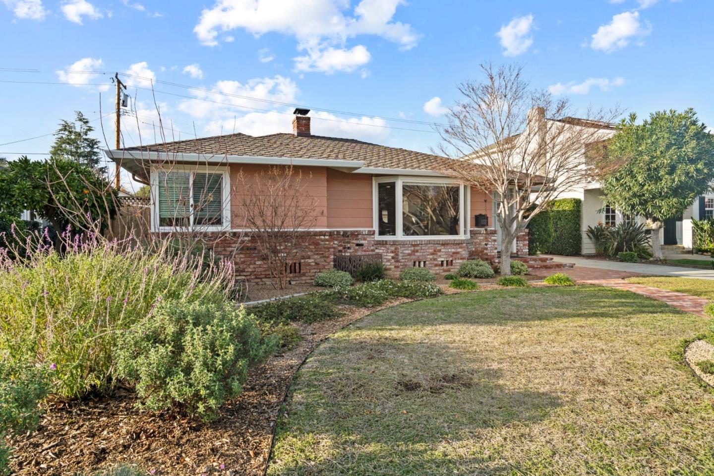 1765 Emory Street San Jose, CA 95126 - Photo 2 of 46 a front view of a house with a yard