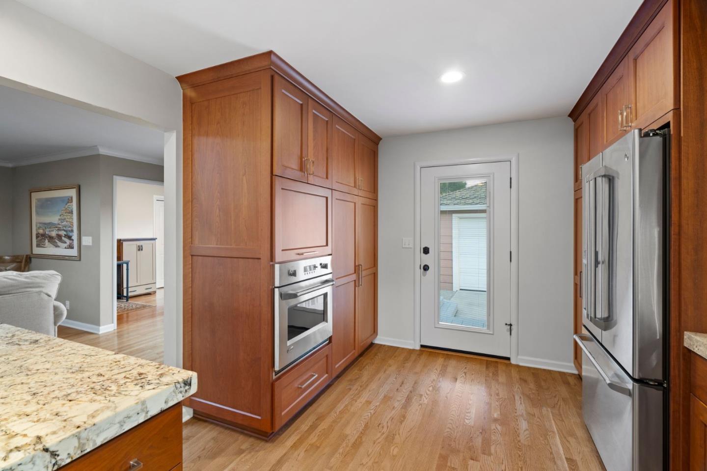 1765 Emory Street San Jose, CA 95126 - Photo 21 of 46 a kitchen with stainless steel appliances granite countertop a refrigerator and a stove