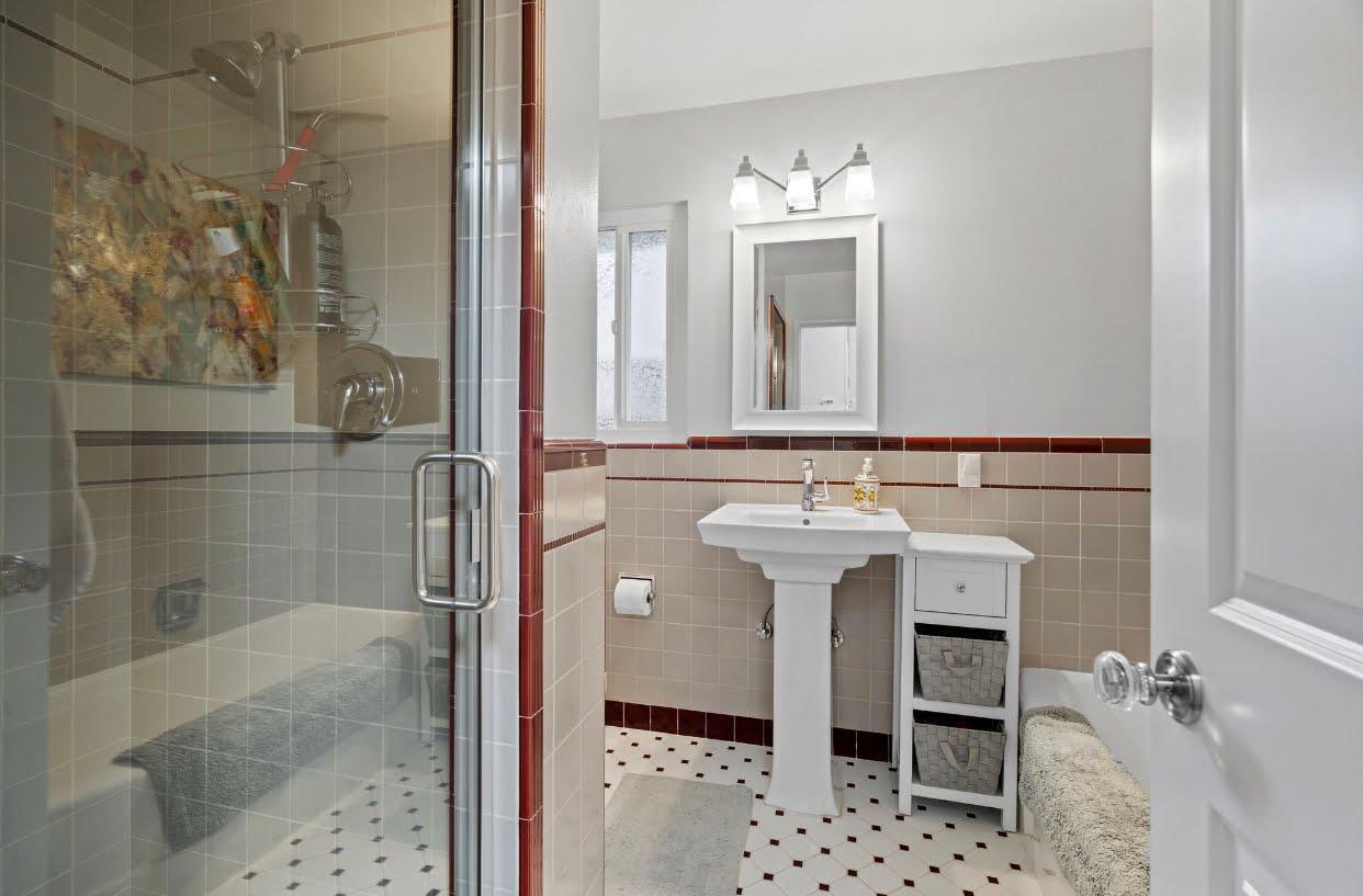 1765 Emory Street San Jose, CA 95126 - Photo 27 of 46 a bathroom with a sink and a mirror