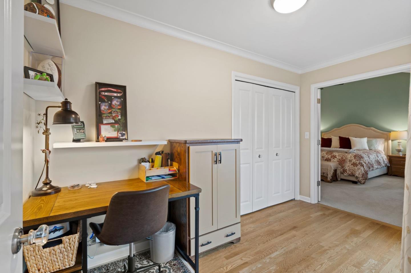 1765 Emory Street San Jose, CA 95126 - Photo 28 of 46 a bedroom with a bed and a chair