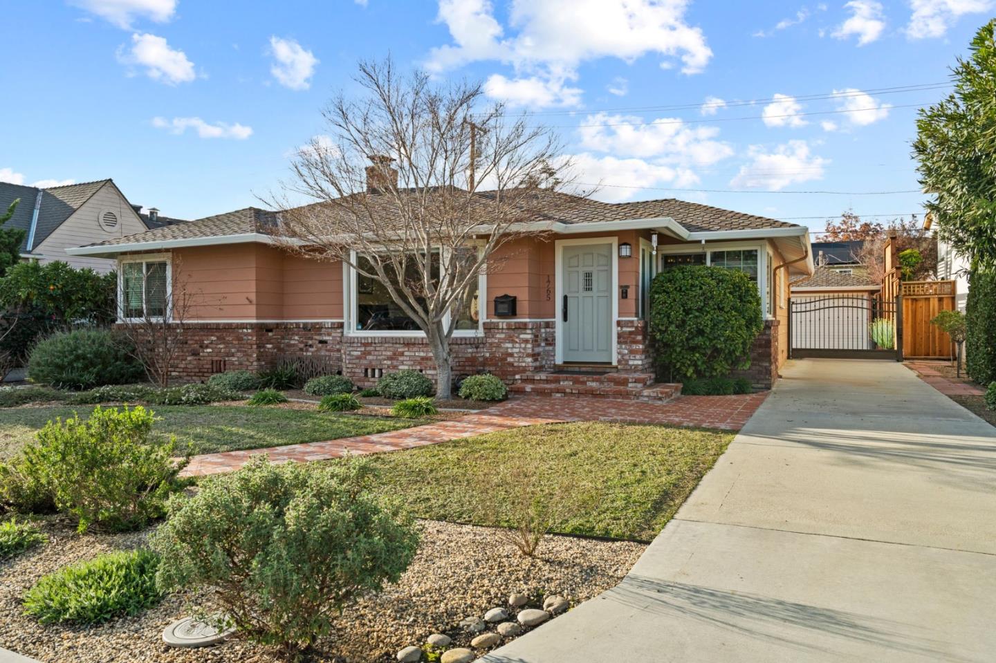 1765 Emory Street San Jose, CA 95126 - Photo 4 of 46 a front view of a house with a yard