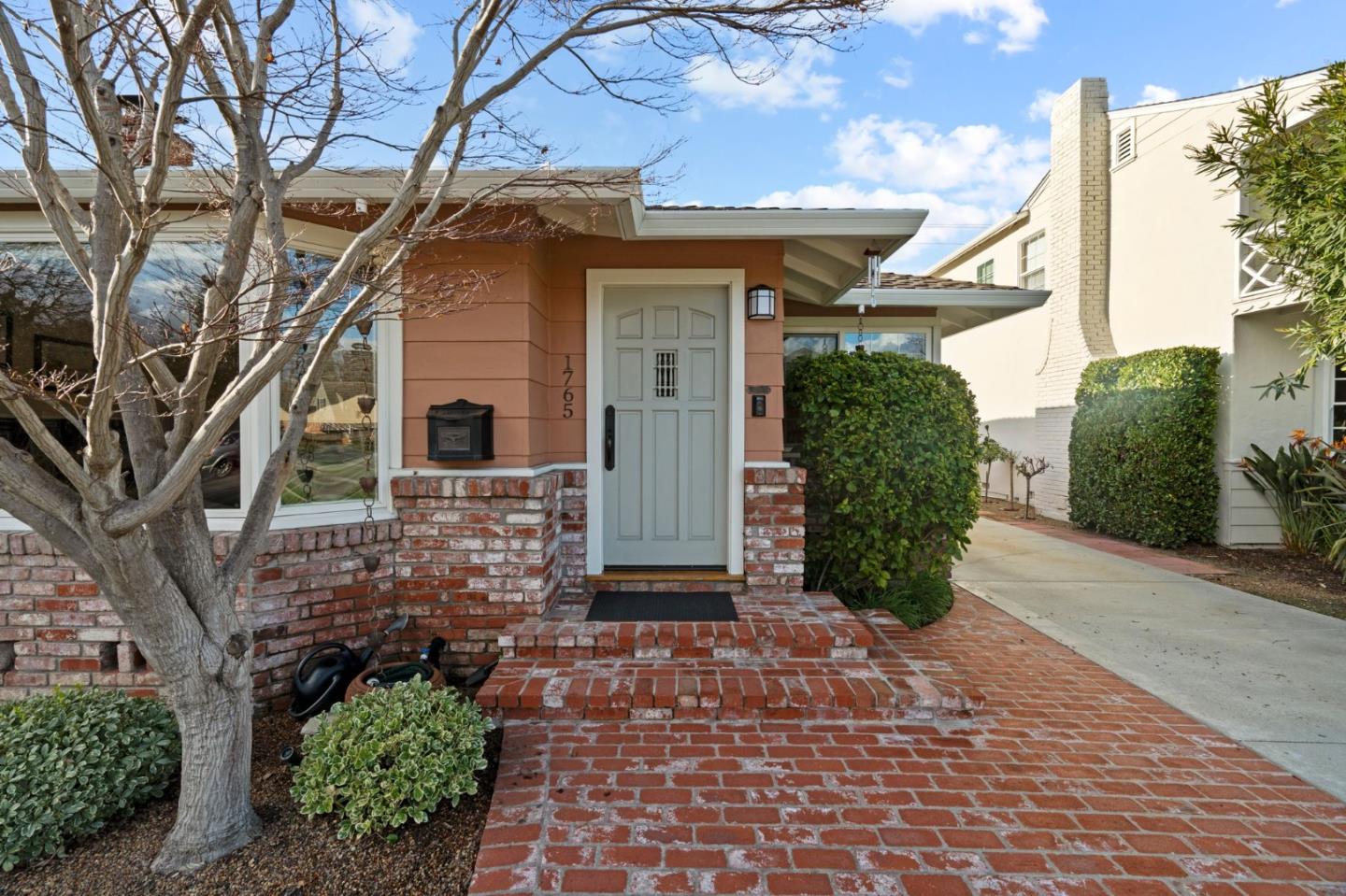 1765 Emory Street San Jose, CA 95126 - Photo 5 of 46 a front view of a house with a yard