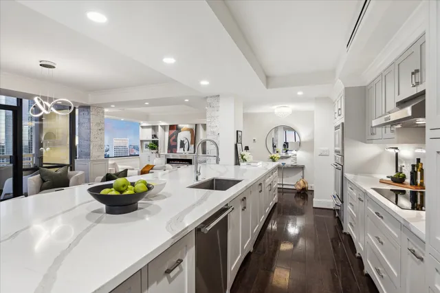 a living room with furniture and a mirror