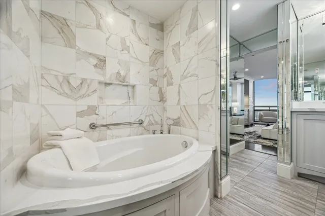 a kitchen with stainless steel appliances granite countertop a sink and cabinets
