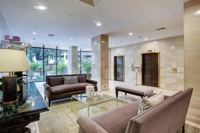 a spacious bathroom with a glass door shower and a sink