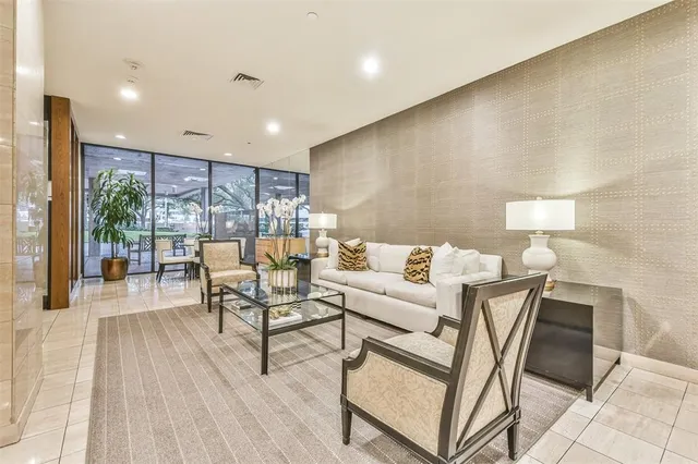 a large room with wooden floor and furniture