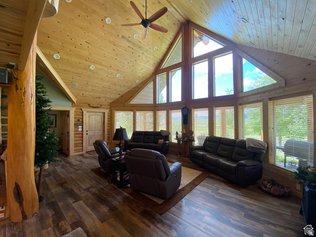 79 Auburn Forest Road Auburn, WY 83111 - Photo 16 of 76 Living room featuring a high wooden ceiling, wood-type flooring, and ceiling fan