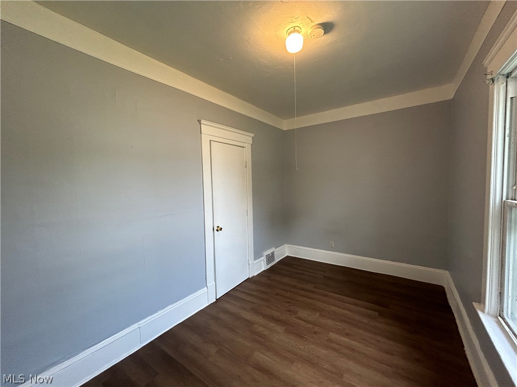 3403 Fulton Road, Unit DOWN Cleveland, OH 44109 - Photo 10 of 18 Spare room featuring wood-type flooring