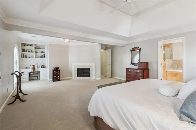 a bedroom with a bed and a fireplace