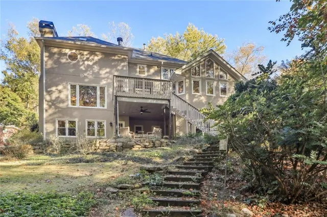 a view of a big house with many windows