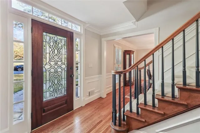 a view of front door with wooden floor
