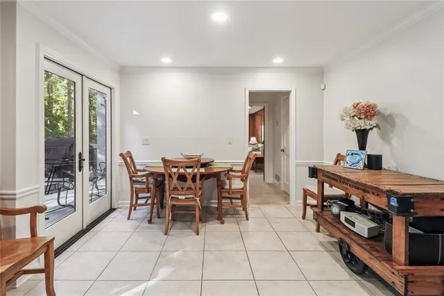 a view of a dining room with furniture and window