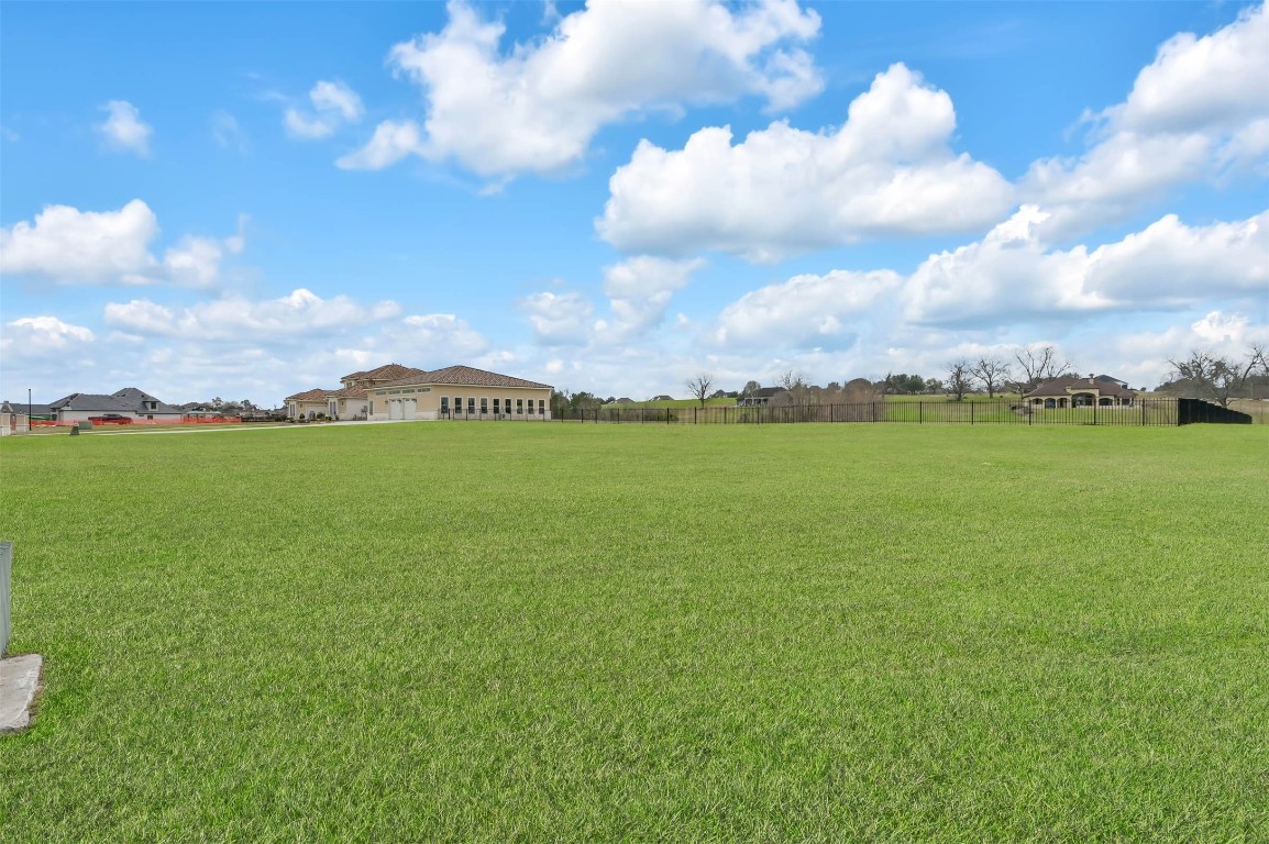 11679 Renaissance Drive Montgomery, TX 77356 - Photo 1 of 2 a view of a lake with houses in the back