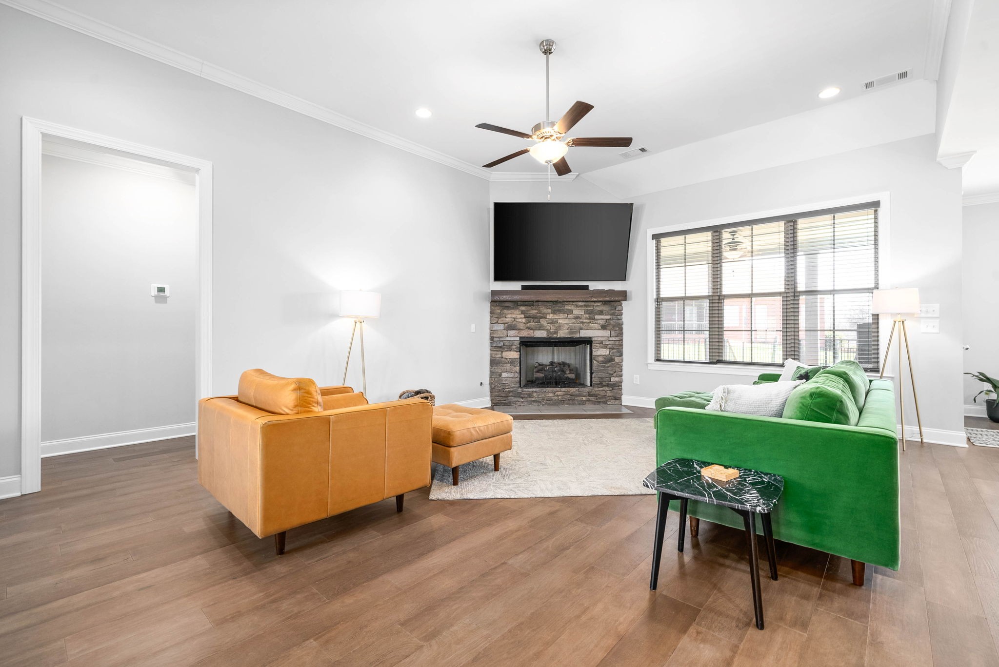2022 Eagle View Road Hendersonville, TN 37075 - Photo 7 of 50 a living room with furniture a fireplace and a flat screen tv