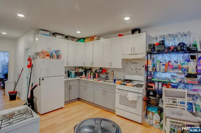 a bedroom with a bed and book shelf