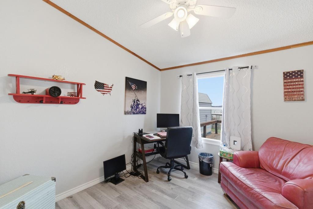 1919 Eastside Lake Road Graham, TX 76450 - Photo 15 of 24 a view of a livingroom with workspace and a couch