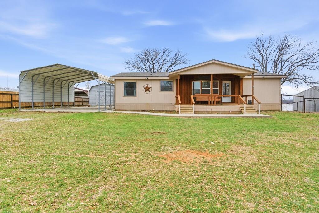 1919 Eastside Lake Road Graham, TX 76450 - Photo 2 of 24 a front view of a house with a yard