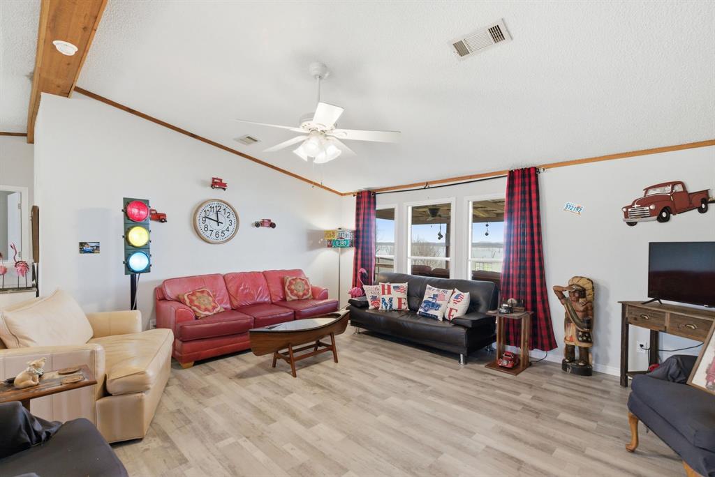 1919 Eastside Lake Road Graham, TX 76450 - Photo 5 of 24 a living room with furniture and a flat screen tv