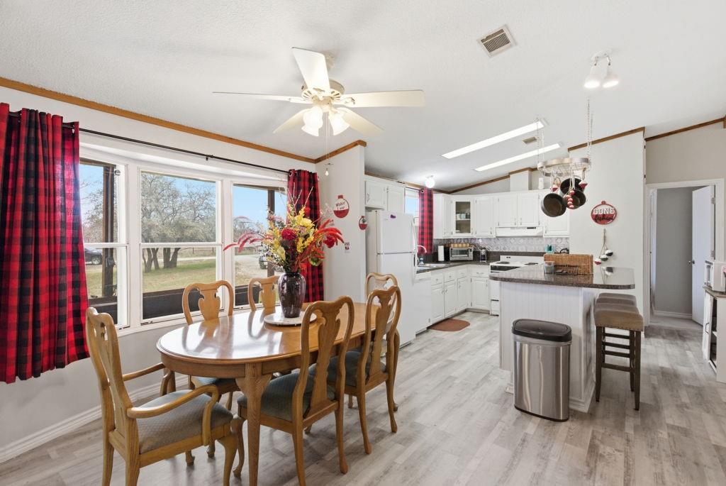 1919 Eastside Lake Road Graham, TX 76450 - Photo 7 of 24 a dining room with furniture and wooden floor