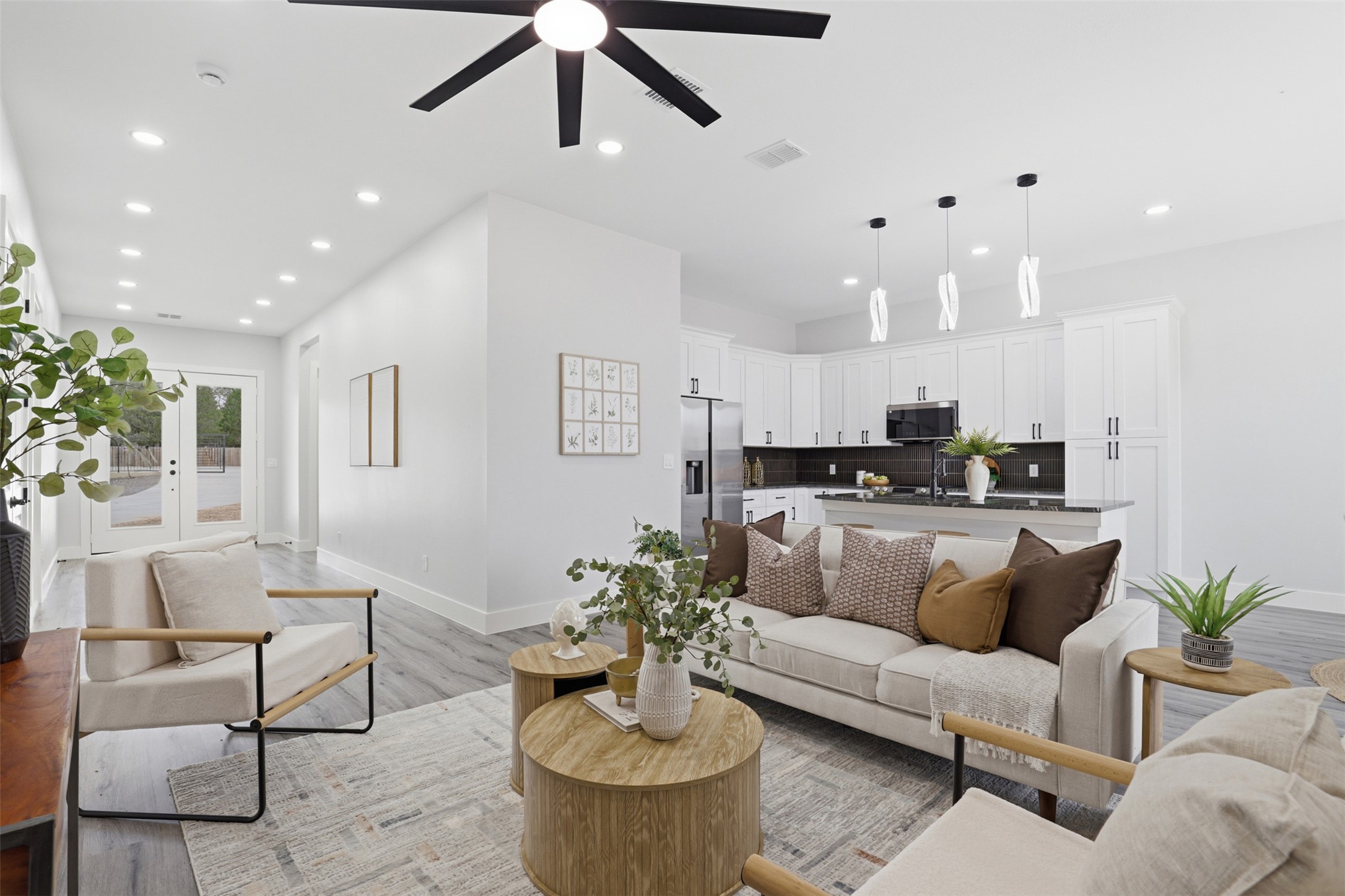 113 Los Robles Road Elgin, TX 78621 - Photo 1 of 20 Open-concept living space with recessed lighting and wood-finish flooring