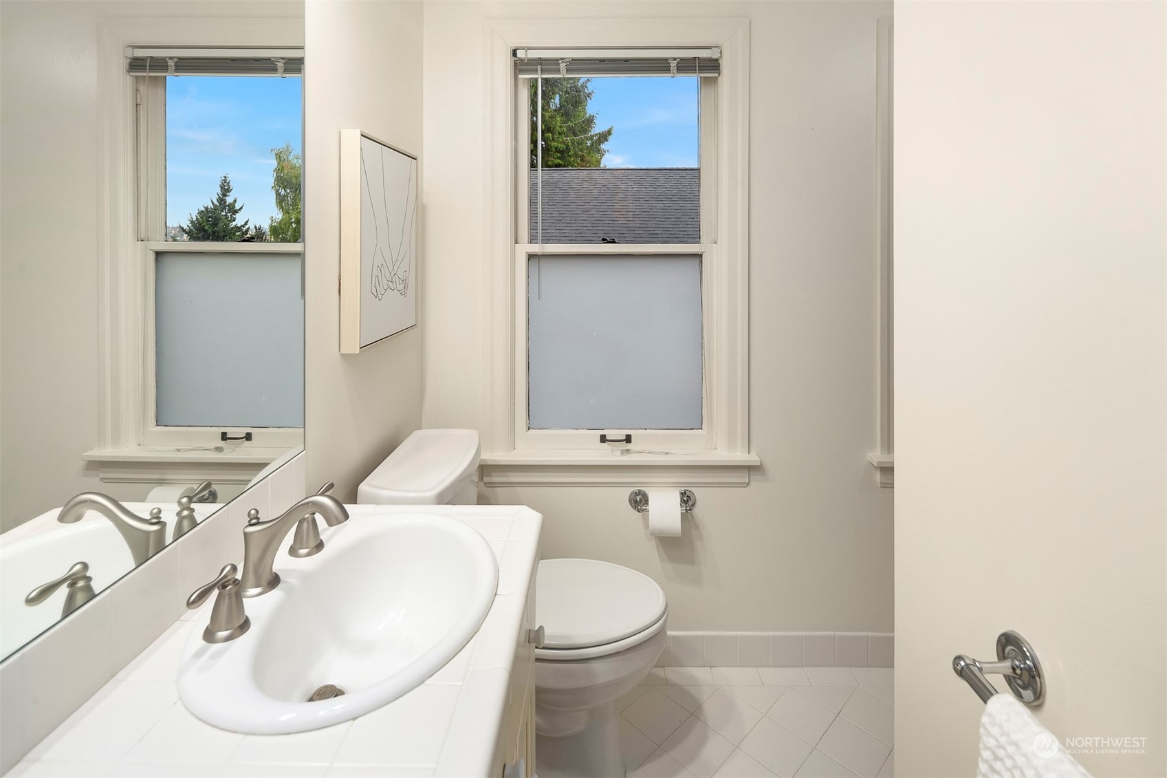 20 Armour Street Seattle, WA 98109 - Photo 20 of 34 a bathroom with a toilet sink and mirror