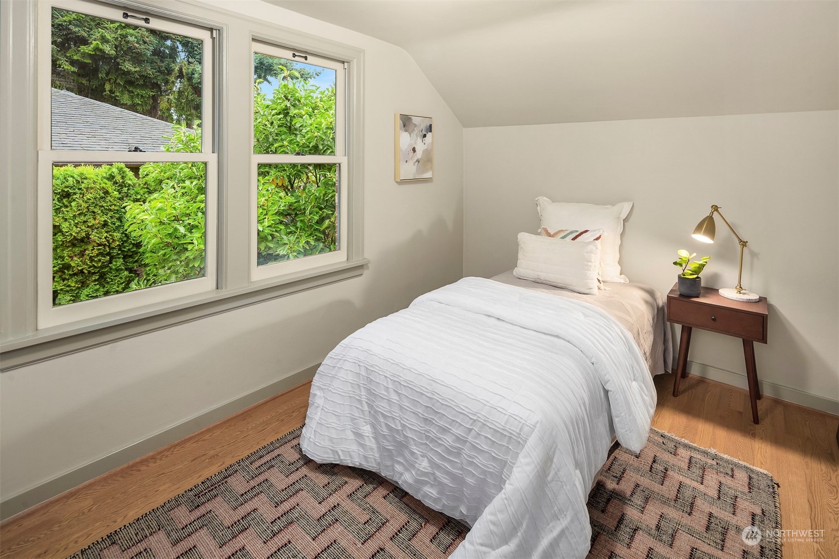 20 Armour Street Seattle, WA 98109 - Photo 26 of 34 a bedroom with a bed and a window
