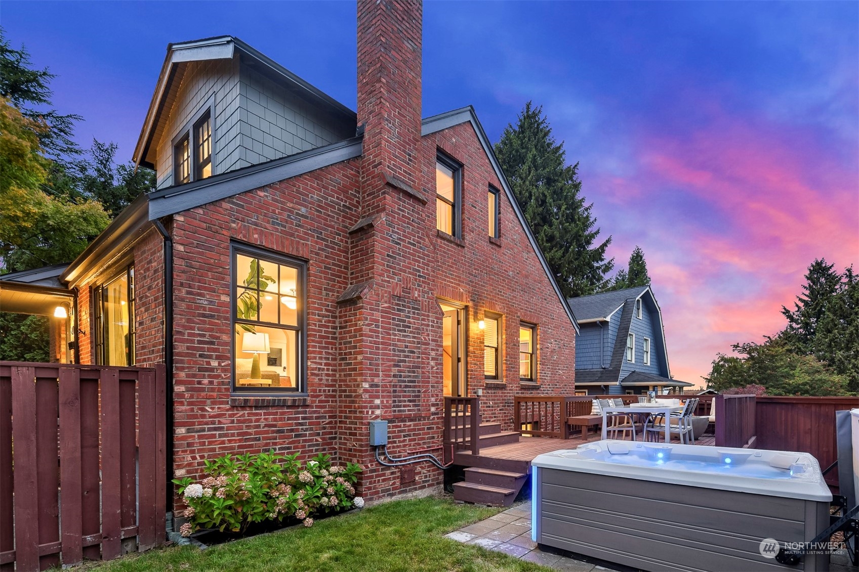 20 Armour Street Seattle, WA 98109 - Photo 30 of 34 a view of a brick house with a large window and potted plants