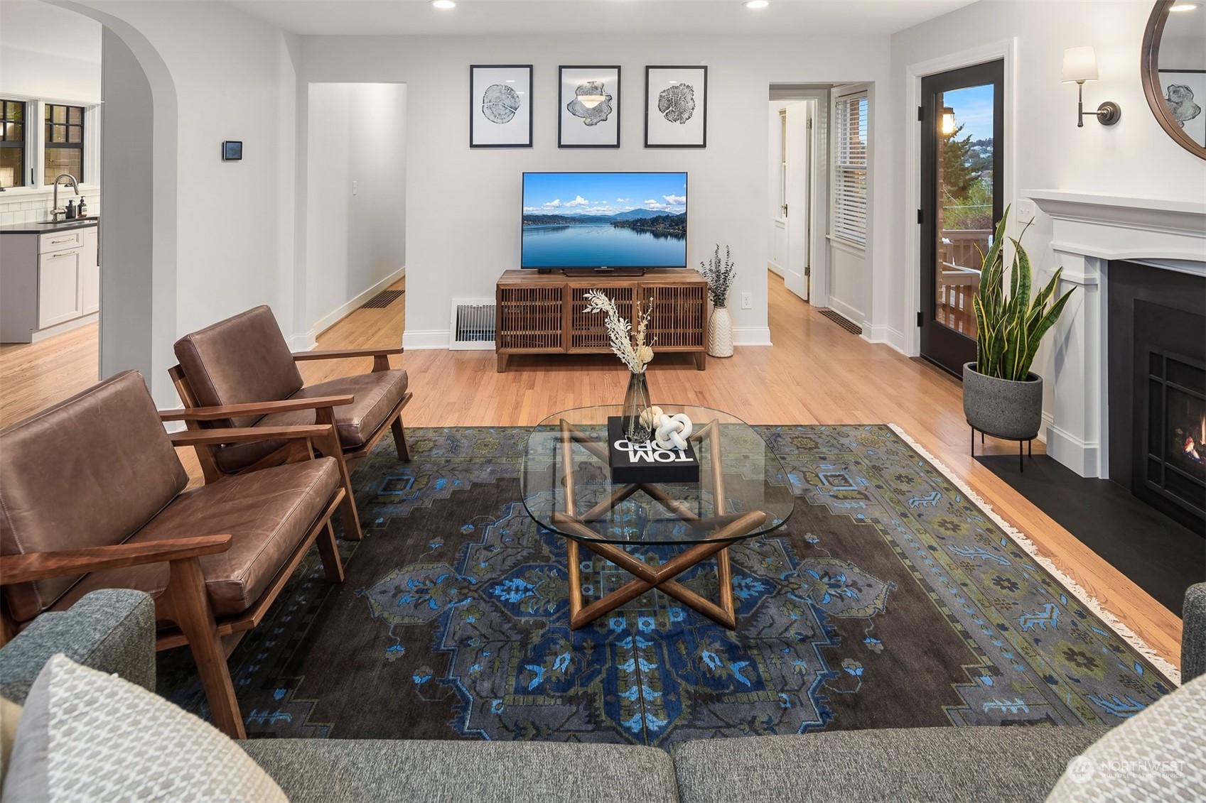 20 Armour Street Seattle, WA 98109 - Photo 6 of 34 a living room with furniture a rug and a fireplace